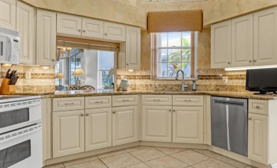 NESTLED IN THE EXCLUSIVE 24/7 DOUBLE-GATED PRIVATE COMMUNITY OF on PGA National Golf Club in Florida - for sale on GolfHomes.com, golf home, golf lot