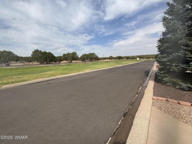 Get a cozy cabin feel in this charming home in desirable Juniper on Juniper Ridge R.V. Golf Resort in Arizona - for sale on GolfHomes.com, golf home, golf lot