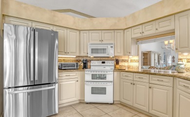 NESTLED IN THE EXCLUSIVE 24/7 DOUBLE-GATED PRIVATE COMMUNITY OF on PGA National Golf Club in Florida - for sale on GolfHomes.com, golf home, golf lot