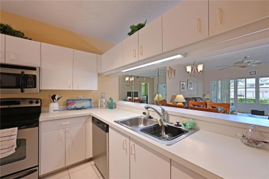 Welcome to this bright and airy first-floor condo in the on Peridia Golf and Country Club in Florida - for sale on GolfHomes.com, golf home, golf lot