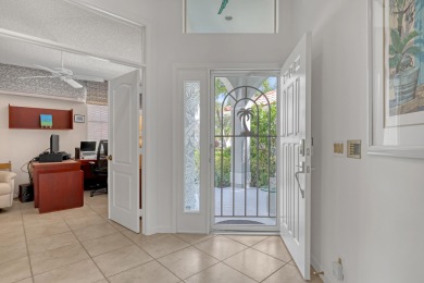 NESTLED IN THE EXCLUSIVE 24/7 DOUBLE-GATED PRIVATE COMMUNITY OF on PGA National Golf Club in Florida - for sale on GolfHomes.com, golf home, golf lot