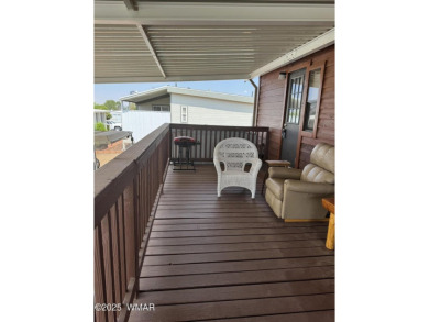 Get a cozy cabin feel in this charming home in desirable Juniper on Juniper Ridge R.V. Golf Resort in Arizona - for sale on GolfHomes.com, golf home, golf lot