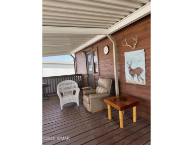 Get a cozy cabin feel in this charming home in desirable Juniper on Juniper Ridge R.V. Golf Resort in Arizona - for sale on GolfHomes.com, golf home, golf lot