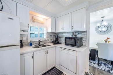 This lovely home has custom updates throughout that give it a on Riviera Golf Club in Florida - for sale on GolfHomes.com, golf home, golf lot