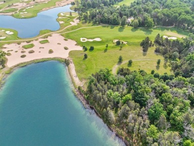 Embrace the pinnacle of golfing luxury with this extraordinary on Forest Dunes Golf Club in Michigan - for sale on GolfHomes.com, golf home, golf lot