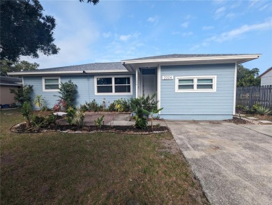 This beautifully maintained three-bedroom, two-bathroom home on The Dunedin Country Club in Florida - for sale on GolfHomes.com, golf home, golf lot