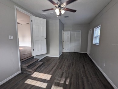 This beautifully maintained three-bedroom, two-bathroom home on The Dunedin Country Club in Florida - for sale on GolfHomes.com, golf home, golf lot