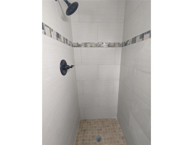 This beautifully maintained three-bedroom, two-bathroom home on The Dunedin Country Club in Florida - for sale on GolfHomes.com, golf home, golf lot