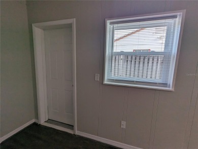 This beautifully maintained three-bedroom, two-bathroom home on The Dunedin Country Club in Florida - for sale on GolfHomes.com, golf home, golf lot