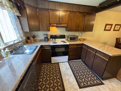 Enjoy four-season living in this inviting 2-bedroom, 1.5-bath on Hermitage Club Golf Course in Vermont - for sale on GolfHomes.com, golf home, golf lot
