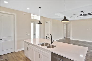 Come view this gorgeous brand-new home nestled feet away from on Burnt Store Golf Club in Florida - for sale on GolfHomes.com, golf home, golf lot