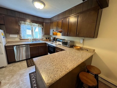 Enjoy four-season living in this inviting 2-bedroom, 1.5-bath on Hermitage Club Golf Course in Vermont - for sale on GolfHomes.com, golf home, golf lot