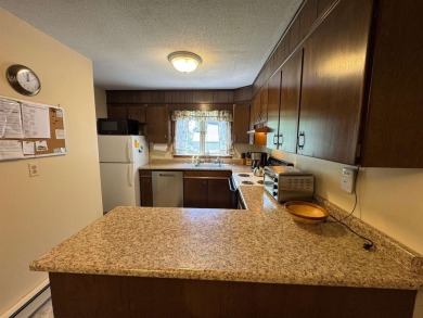 Enjoy four-season living in this inviting 2-bedroom, 1.5-bath on Hermitage Club Golf Course in Vermont - for sale on GolfHomes.com, golf home, golf lot