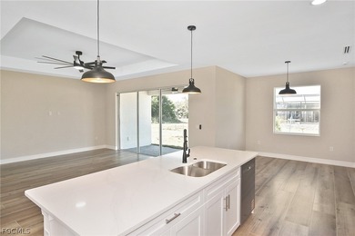 Come view this gorgeous brand-new home nestled feet away from on Burnt Store Golf Club in Florida - for sale on GolfHomes.com, golf home, golf lot