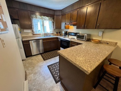 Enjoy four-season living in this inviting 2-bedroom, 1.5-bath on Hermitage Club Golf Course in Vermont - for sale on GolfHomes.com, golf home, golf lot