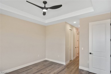 Come view this gorgeous brand-new home nestled feet away from on Burnt Store Golf Club in Florida - for sale on GolfHomes.com, golf home, golf lot