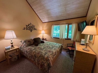 Enjoy four-season living in this inviting 2-bedroom, 1.5-bath on Hermitage Club Golf Course in Vermont - for sale on GolfHomes.com, golf home, golf lot