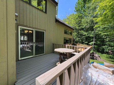 Enjoy four-season living in this inviting 2-bedroom, 1.5-bath on Hermitage Club Golf Course in Vermont - for sale on GolfHomes.com, golf home, golf lot