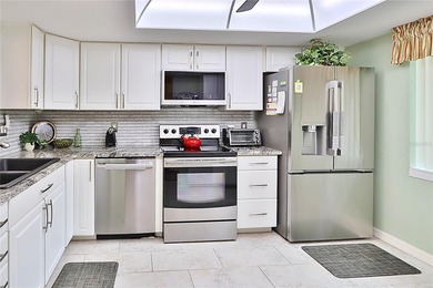 WELCOME TO THIS METICULOUS CHARMING VILLA IN HIGHLAND LAKES. 2 on Highland Lakes Executive Golf Course in Florida - for sale on GolfHomes.com, golf home, golf lot