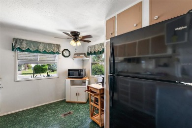 This 2-bedroom, 2-bath furnished mobile home located in the on Bay Tree Golf Course in Florida - for sale on GolfHomes.com, golf home, golf lot