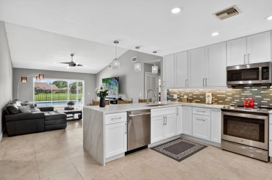 Contemporary and move in ready, recently renovated open kitchen on Boca Greens Country Club in Florida - for sale on GolfHomes.com, golf home, golf lot