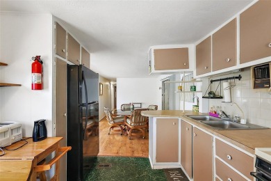 This 2-bedroom, 2-bath furnished mobile home located in the on Bay Tree Golf Course in Florida - for sale on GolfHomes.com, golf home, golf lot