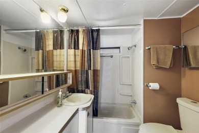 This 2-bedroom, 2-bath furnished mobile home located in the on Bay Tree Golf Course in Florida - for sale on GolfHomes.com, golf home, golf lot