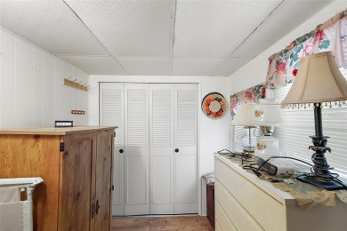 This 2-bedroom, 2-bath furnished mobile home located in the on Bay Tree Golf Course in Florida - for sale on GolfHomes.com, golf home, golf lot