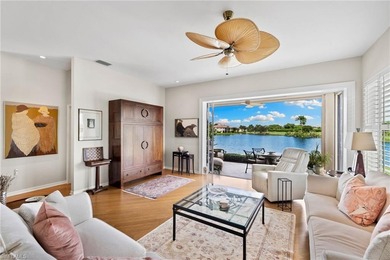 Enjoy spectacular panoramic lake and golf course views from this on Windstar on Naples Bay in Florida - for sale on GolfHomes.com, golf home, golf lot
