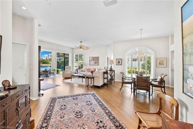 Enjoy spectacular panoramic lake and golf course views from this on Windstar on Naples Bay in Florida - for sale on GolfHomes.com, golf home, golf lot