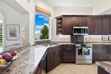 Enjoy spectacular panoramic lake and golf course views from this on Windstar on Naples Bay in Florida - for sale on GolfHomes.com, golf home, golf lot