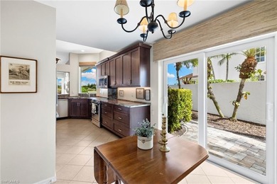 Enjoy spectacular panoramic lake and golf course views from this on Windstar on Naples Bay in Florida - for sale on GolfHomes.com, golf home, golf lot