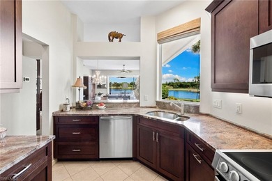 Enjoy spectacular panoramic lake and golf course views from this on Windstar on Naples Bay in Florida - for sale on GolfHomes.com, golf home, golf lot