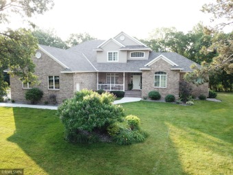This beautiful custom built home is situated on a wooded lot on Oak Hill Golf Club in Minnesota - for sale on GolfHomes.com, golf home, golf lot