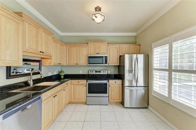 Discover the charm and convenience of this delightful two-story on University Park Country Club in Florida - for sale on GolfHomes.com, golf home, golf lot