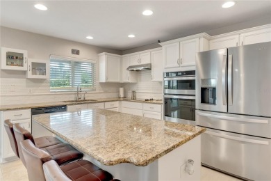 Fall in love with this stunning home nestled in the prestigious on Eagle Creek Golf Club in Florida - for sale on GolfHomes.com, golf home, golf lot