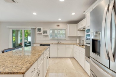 Fall in love with this stunning home nestled in the prestigious on Eagle Creek Golf Club in Florida - for sale on GolfHomes.com, golf home, golf lot