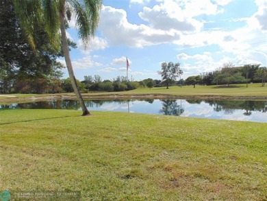 FIRST FLOOR CORNER UNIT WITH GOLF AND WATER VIEW. BEAUTIFUL on Oriole Golf and Tennis Club in Florida - for sale on GolfHomes.com, golf home, golf lot