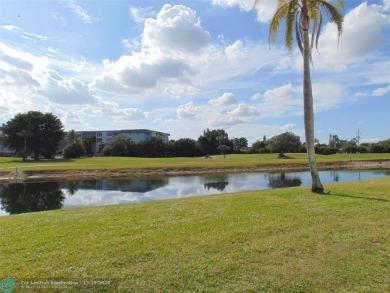 FIRST FLOOR CORNER UNIT WITH GOLF AND WATER VIEW. BEAUTIFUL on Oriole Golf and Tennis Club in Florida - for sale on GolfHomes.com, golf home, golf lot