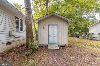 Charming Cedar Style Chalet, nestled among the trees on a on River Run Golf Club in Maryland - for sale on GolfHomes.com, golf home, golf lot