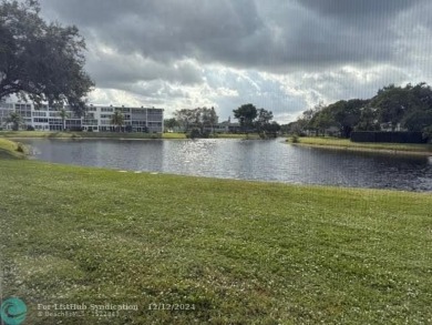 LOOK NO FURTHER , THIS IS IT! WHAT A LAKE VIEW THIS UNIT HAS on Hillsboro Pines Golf in Florida - for sale on GolfHomes.com, golf home, golf lot