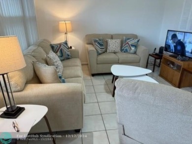 LOOK NO FURTHER , THIS IS IT! WHAT A LAKE VIEW THIS UNIT HAS on Hillsboro Pines Golf in Florida - for sale on GolfHomes.com, golf home, golf lot