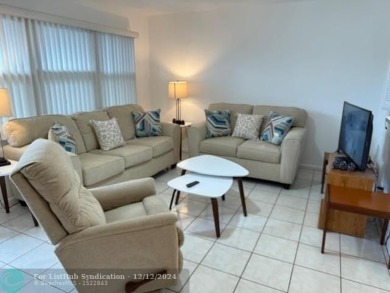 LOOK NO FURTHER , THIS IS IT! WHAT A LAKE VIEW THIS UNIT HAS on Hillsboro Pines Golf in Florida - for sale on GolfHomes.com, golf home, golf lot