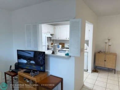 LOOK NO FURTHER , THIS IS IT! WHAT A LAKE VIEW THIS UNIT HAS on Hillsboro Pines Golf in Florida - for sale on GolfHomes.com, golf home, golf lot