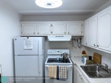 LOOK NO FURTHER , THIS IS IT! WHAT A LAKE VIEW THIS UNIT HAS on Hillsboro Pines Golf in Florida - for sale on GolfHomes.com, golf home, golf lot
