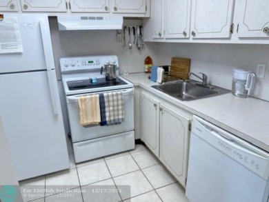 LOOK NO FURTHER , THIS IS IT! WHAT A LAKE VIEW THIS UNIT HAS on Hillsboro Pines Golf in Florida - for sale on GolfHomes.com, golf home, golf lot