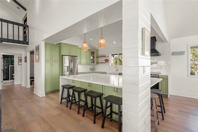 Panoramic lake and golf course views from this elegant island on The Dunes Golf and Tennis Club in Florida - for sale on GolfHomes.com, golf home, golf lot