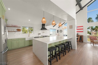 Panoramic lake and golf course views from this elegant island on The Dunes Golf and Tennis Club in Florida - for sale on GolfHomes.com, golf home, golf lot