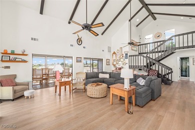 Panoramic lake and golf course views from this elegant island on The Dunes Golf and Tennis Club in Florida - for sale on GolfHomes.com, golf home, golf lot