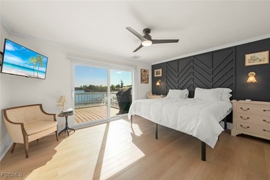 Panoramic lake and golf course views from this elegant island on The Dunes Golf and Tennis Club in Florida - for sale on GolfHomes.com, golf home, golf lot